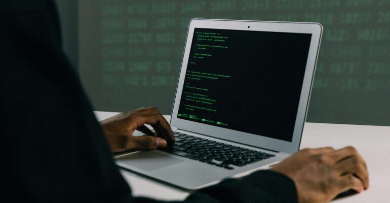 Free Person Using Macbook Air Stock Photo