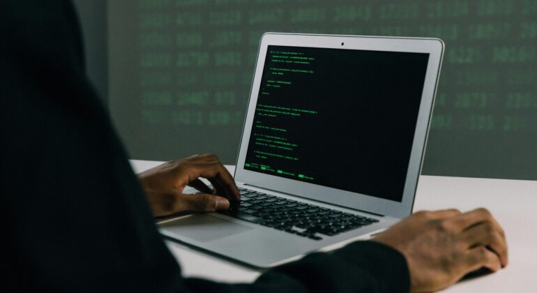 Free Person Using Macbook Air Stock Photo