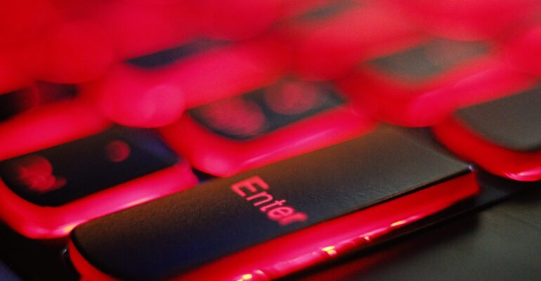 a close up of a red and black keyboard
