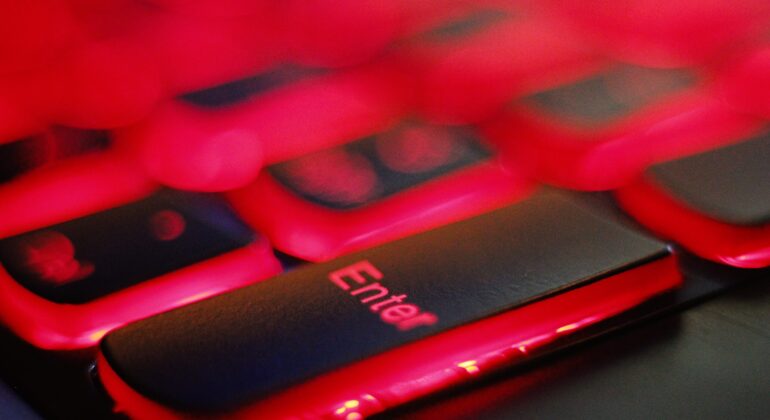 a close up of a red and black keyboard
