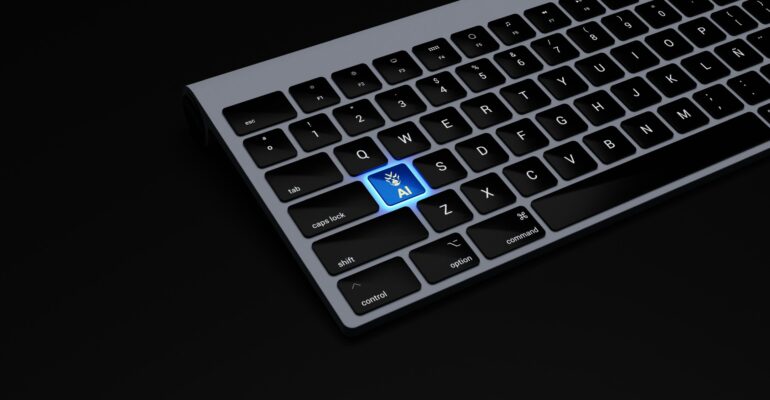 a black keyboard with a blue button on it