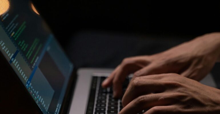 person-using-silver-and-black-laptop-computer