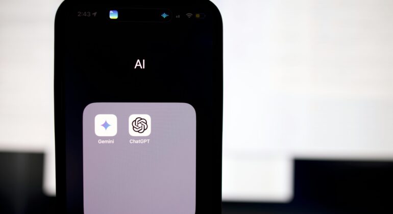 a close up of a cell phone with an ai button