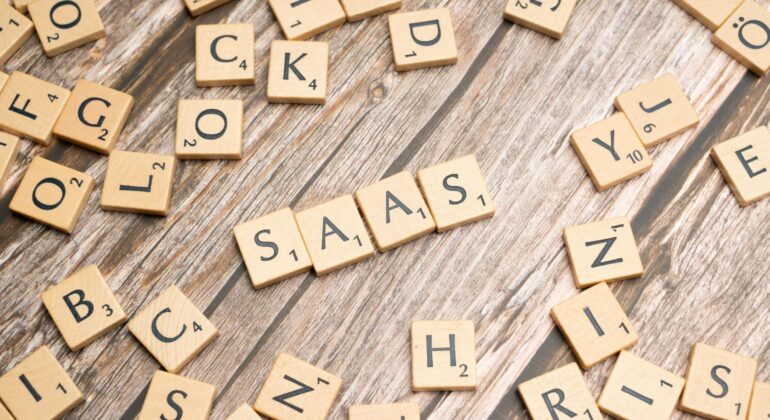 scrabble-letters-spelling-saas-on-a-wooden-tabl